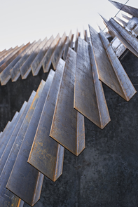 Low-maintenance, durable building materials include unfinished metal "fins" that are developing a patina and provide shade to the building. (Photo: Liam Frederick) Low-maintenance, durable building materials include unfinished metal "fins" that are developing a patina and provide shade to the building. (Photo: Liam Frederick)